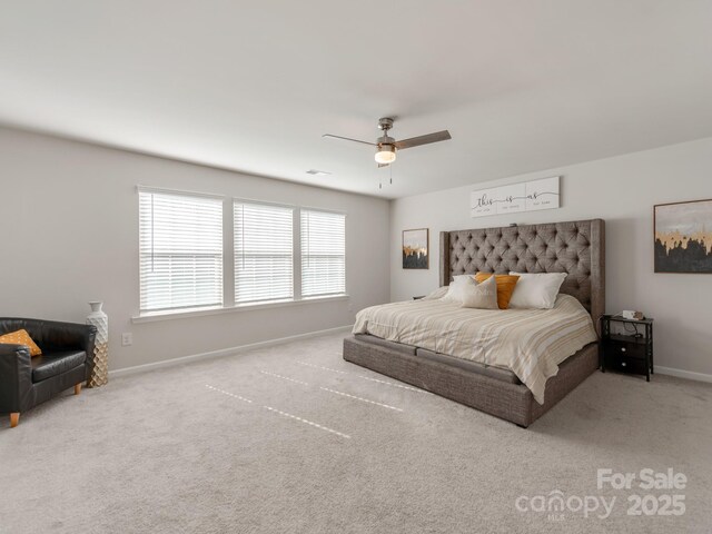 bedroom featuring ceiling fan, carpet floors, and baseboards