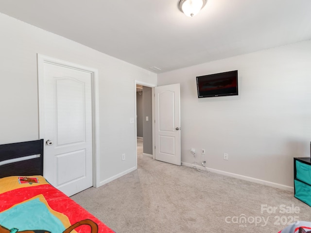 carpeted bedroom with baseboards