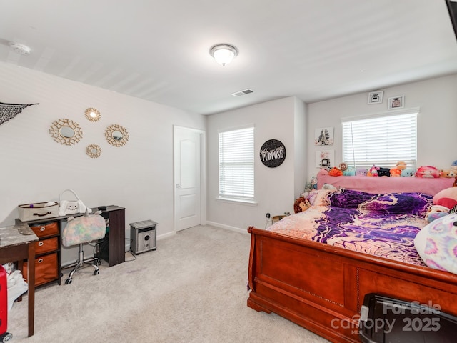 carpeted bedroom featuring baseboards and visible vents