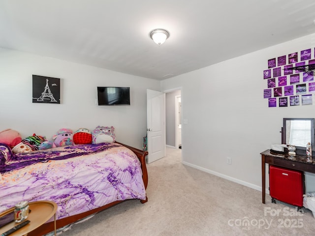 carpeted bedroom featuring baseboards