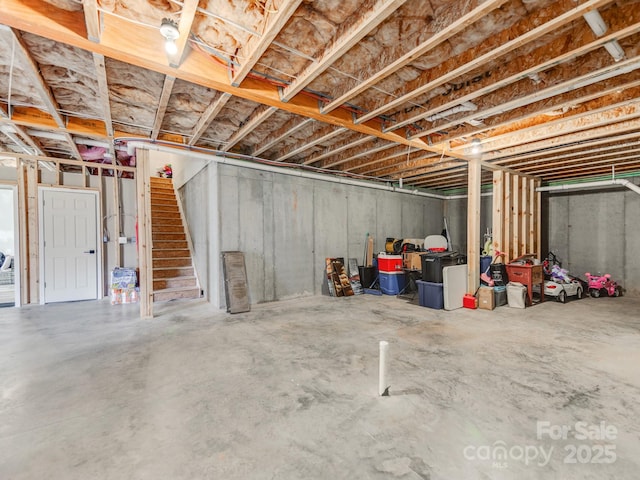 unfinished basement with stairs