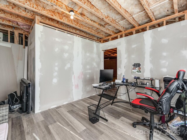 home office with wood finished floors