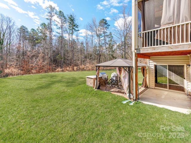 view of yard featuring a patio area and a gazebo