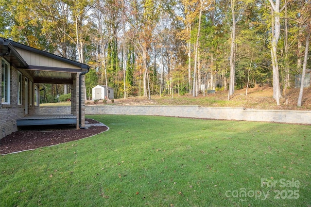 view of yard with a storage shed and an outdoor structure