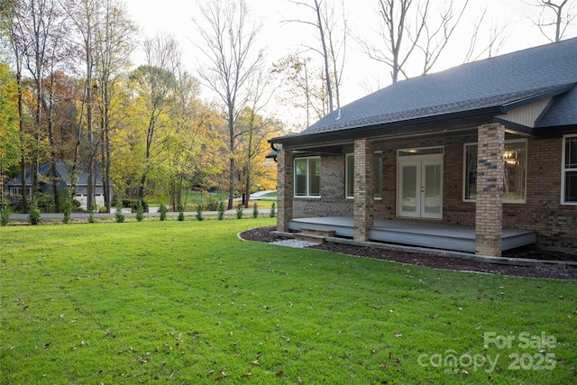 view of yard with french doors