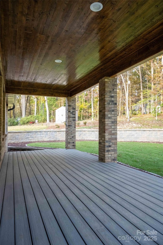 deck featuring a lawn