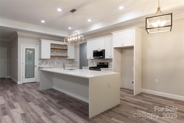 kitchen featuring stainless steel appliances, a sink, white cabinetry, light countertops, and open shelves