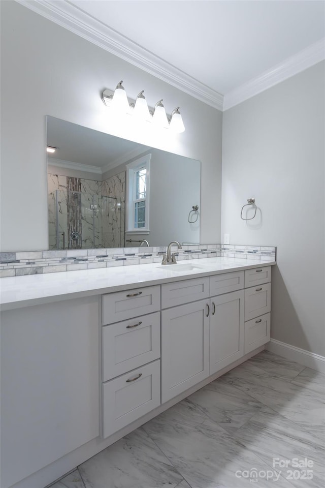 bathroom featuring marble finish floor, ornamental molding, a marble finish shower, and vanity