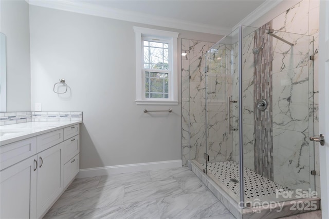 bathroom featuring vanity, baseboards, marble finish floor, a marble finish shower, and crown molding