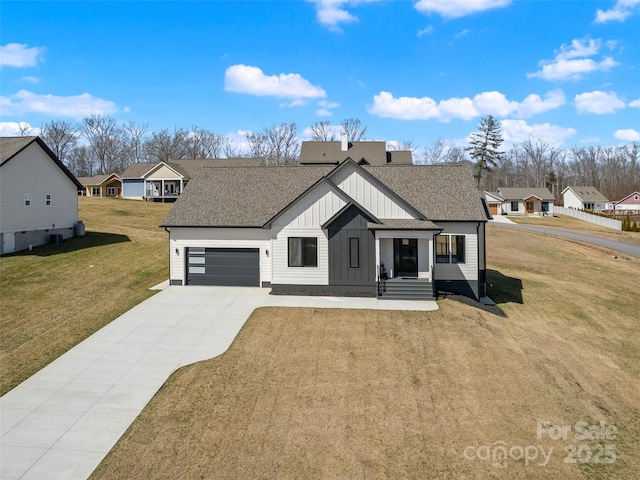 modern inspired farmhouse with a shingled roof, board and batten siding, a garage, driveway, and a front lawn