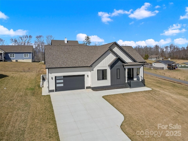 modern farmhouse style home with a shingled roof, concrete driveway, an attached garage, board and batten siding, and a front lawn