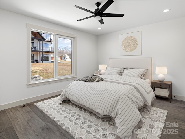 bedroom with ceiling fan, recessed lighting, wood finished floors, visible vents, and baseboards