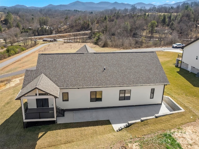 birds eye view of property with a mountain view