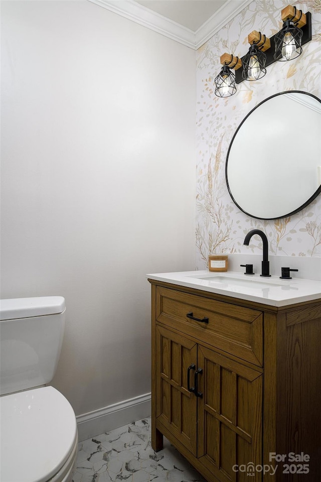 half bathroom featuring wallpapered walls, baseboards, toilet, ornamental molding, and marble finish floor