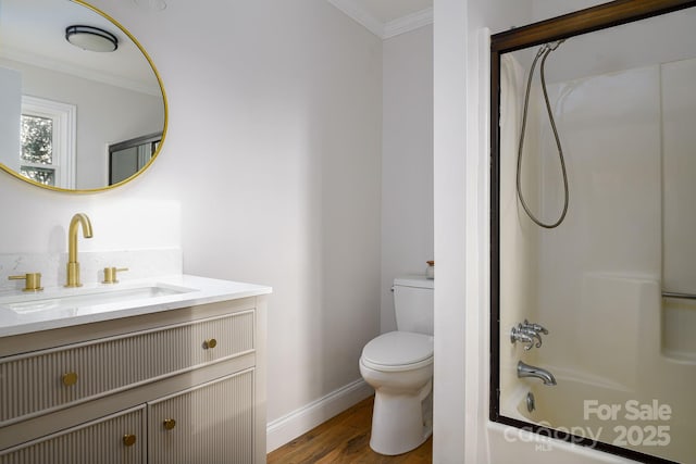 full bath with toilet, shower / tub combination, ornamental molding, wood finished floors, and vanity