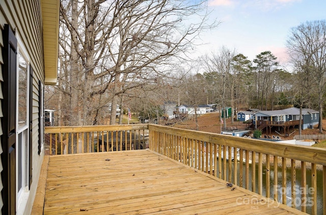 wooden terrace with a residential view