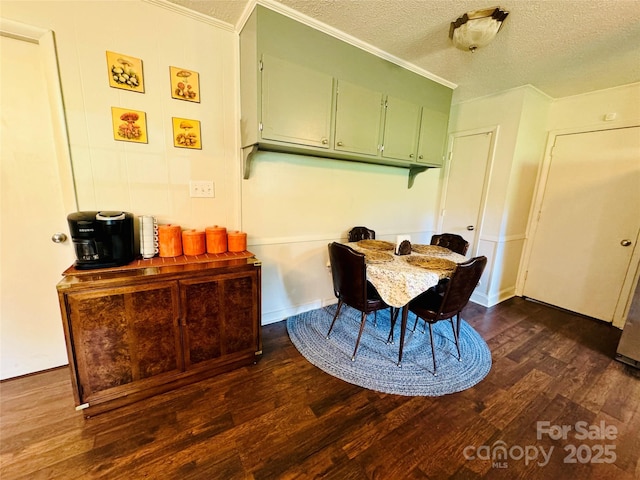 dining room with dark wood-style floors and a textured ceiling