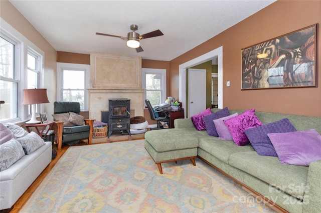 living room featuring ceiling fan and wood finished floors