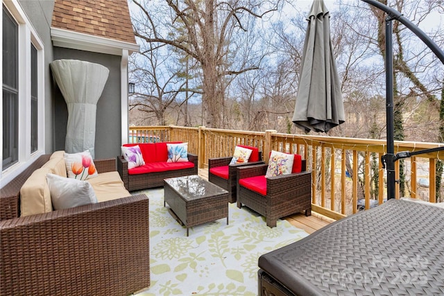 wooden terrace with an outdoor hangout area