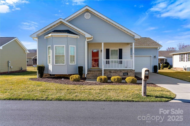 view of front of house featuring a porch, a front yard, concrete driveway, and a garage