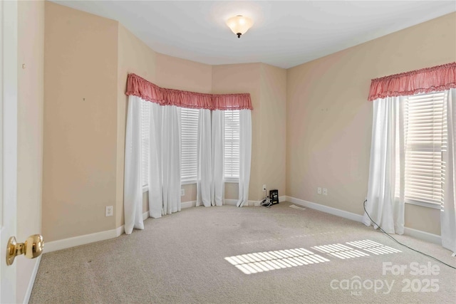 357 Beechnut Dr, Hendersonville, NC 28739 - empty room with carpet floors, a healthy amount of sunlight, and baseboards