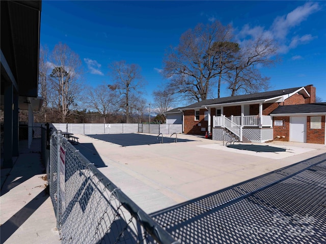 357 Beechnut Dr, Hendersonville, NC 28739 - exterior space with fence private yard, a porch, and brick siding