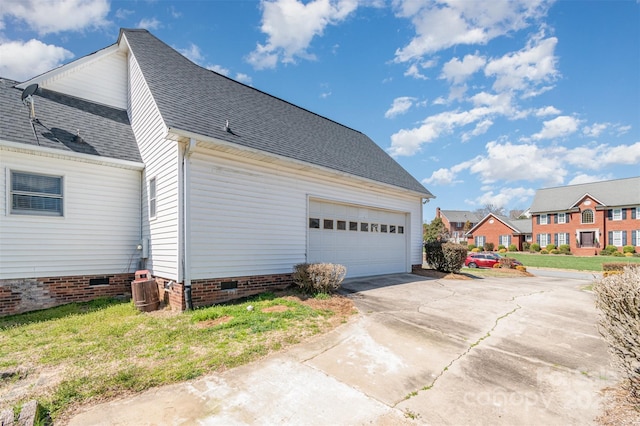 view of side of home featuring a garage, a residential view, roof with shingles, crawl space, and central AC unit