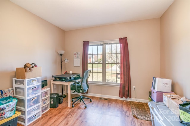 office with baseboards and wood finished floors