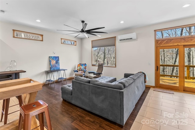 living area featuring recessed lighting, dark wood-style flooring, and a wall mounted AC