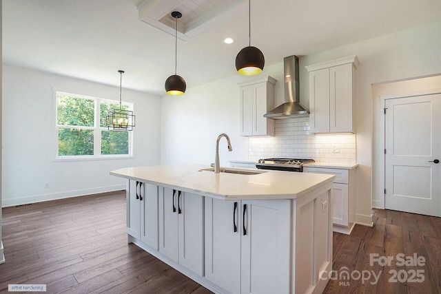 1906 Maius Dr, Conover, NC 28613 - kitchen featuring wall chimney exhaust hood, stainless steel range oven, an island with sink, decorative backsplash, and a sink