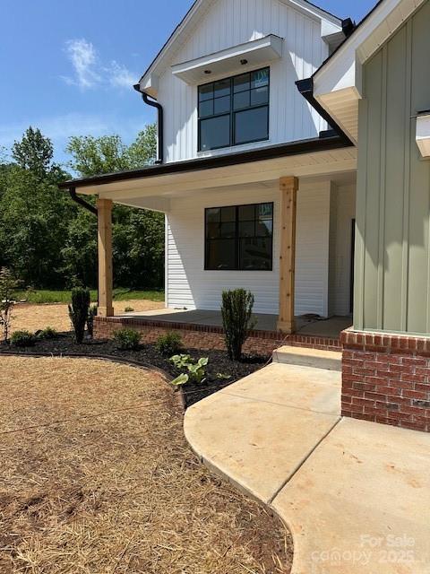 1906 Maius Dr, Conover, NC 28613 - doorway to property featuring a porch and board and batten siding