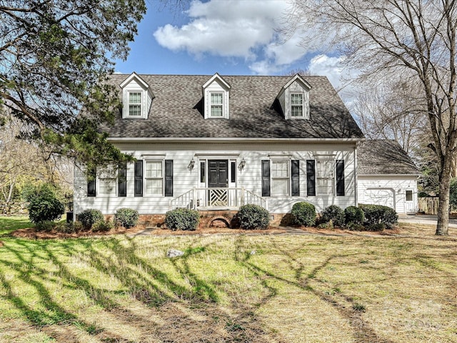 cape cod house with a shingled roof, a front yard, and crawl space