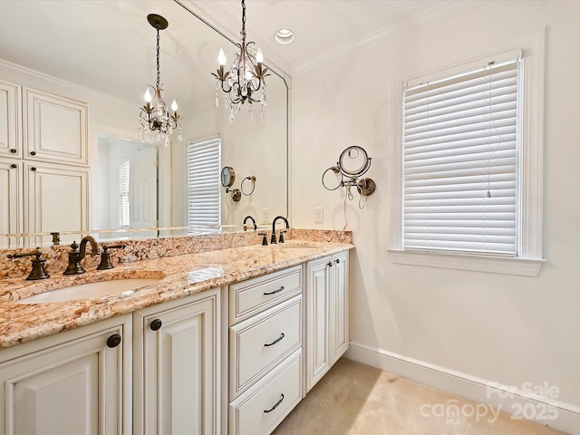 bathroom featuring crown molding, a sink, baseboards, and double vanity