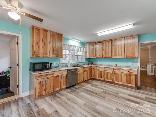 kitchen with black microwave, a sink, visible vents, light wood-style floors, and stainless steel dishwasher