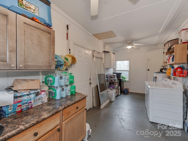 kitchen with baseboards, a ceiling fan, dark countertops, independent washer and dryer, and finished concrete floors