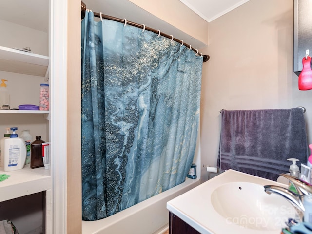 bathroom featuring crown molding, vanity, and shower / bath combo with shower curtain