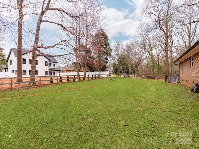 view of yard with fence