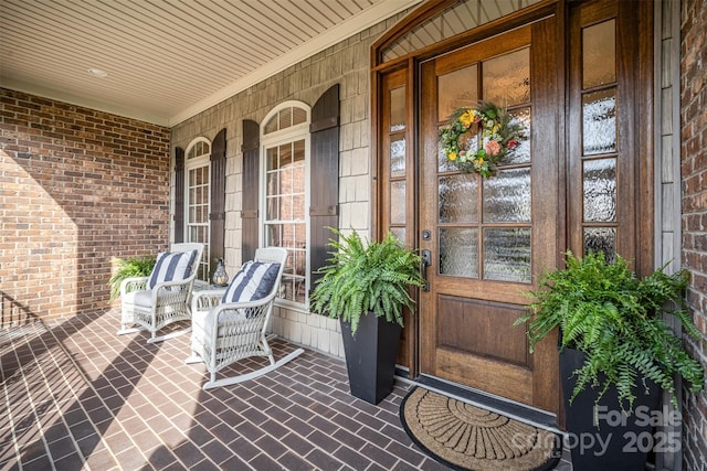 doorway to property featuring a porch