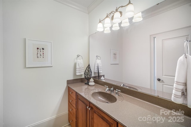 bathroom with vanity and ornamental molding