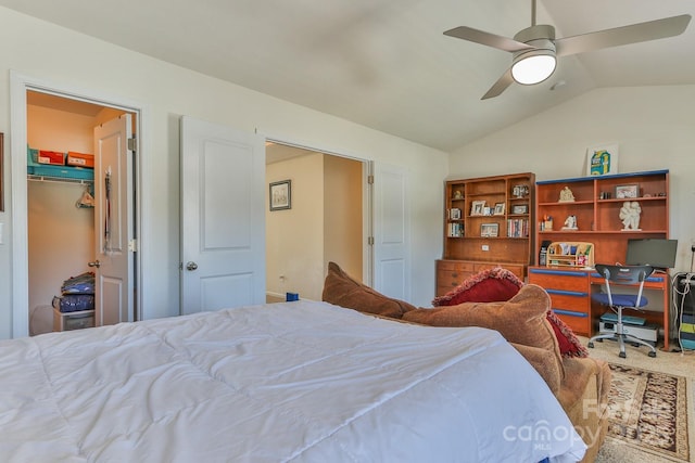 carpeted bedroom with vaulted ceiling and a ceiling fan