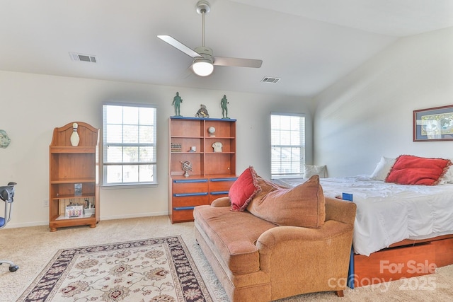 bedroom featuring lofted ceiling, carpet floors, baseboards, and visible vents