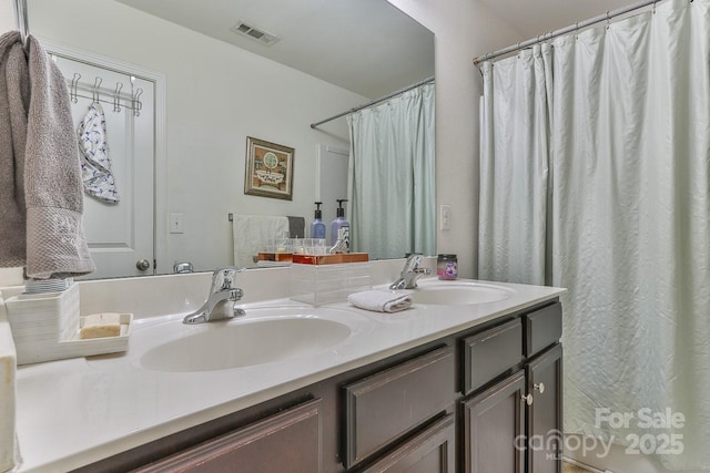 bathroom featuring double vanity, a sink, visible vents, and a shower with curtain