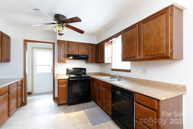 kitchen featuring a ceiling fan, under cabinet range hood, light countertops, black appliances, and a sink