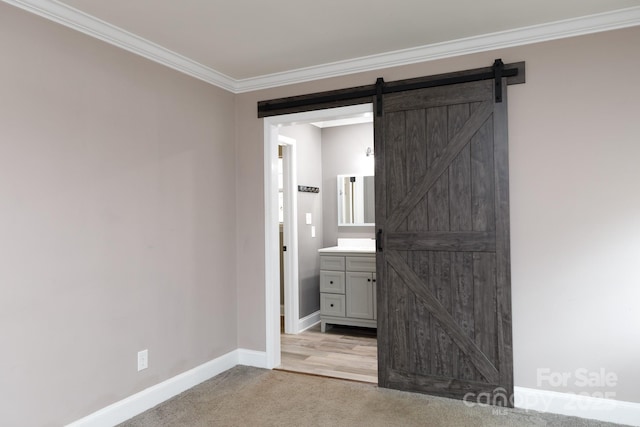 bathroom featuring crown molding, vanity, and baseboards