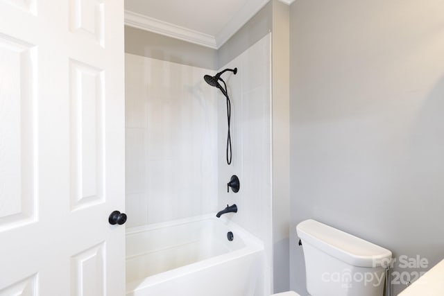 bathroom with ornamental molding, toilet, and shower / bathtub combination