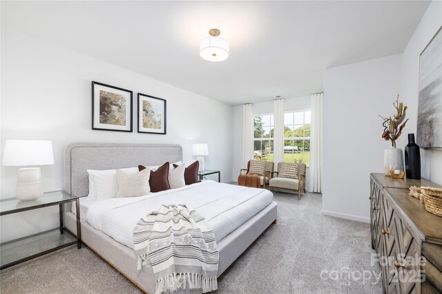 carpeted bedroom with baseboards