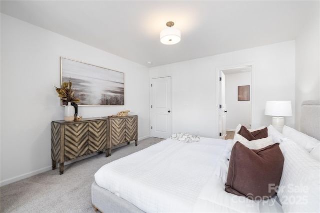 bedroom with baseboards and carpet floors