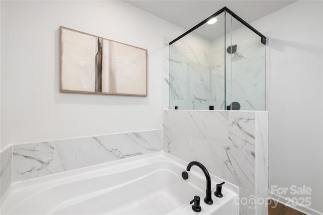 full bath with a marble finish shower and a bath