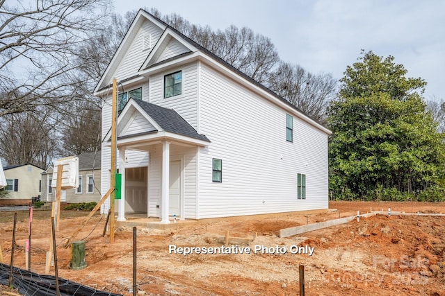 view of front of home with roof with shingles