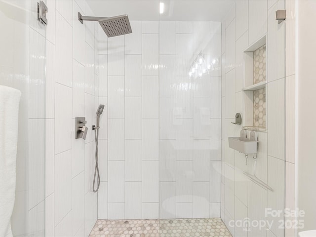 bathroom with a tile shower